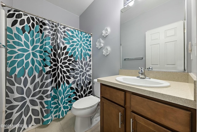 bathroom with vanity, toilet, and tile patterned flooring