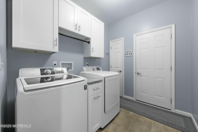 washroom with cabinets and separate washer and dryer