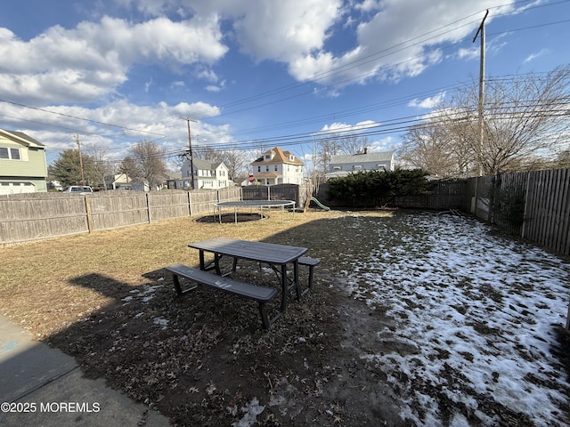 view of yard featuring a playground and a trampoline