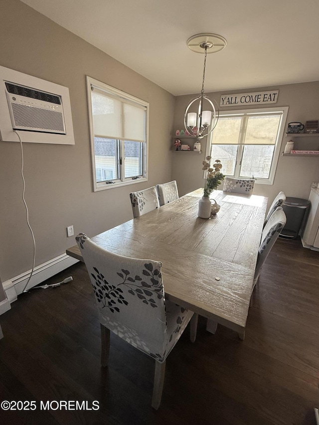 dining room with a baseboard heating unit, dark hardwood / wood-style floors, a wall mounted AC, and a healthy amount of sunlight