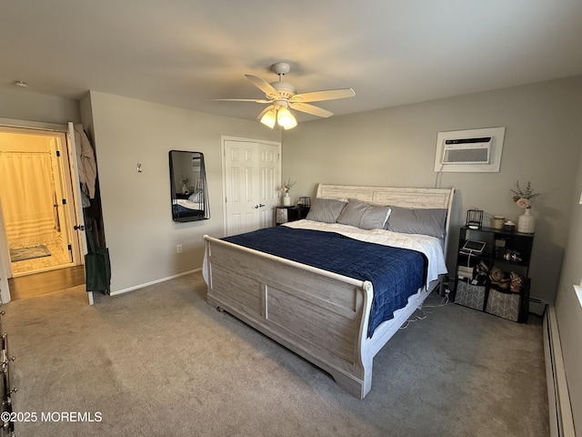 carpeted bedroom with ceiling fan, a baseboard radiator, a closet, and an AC wall unit