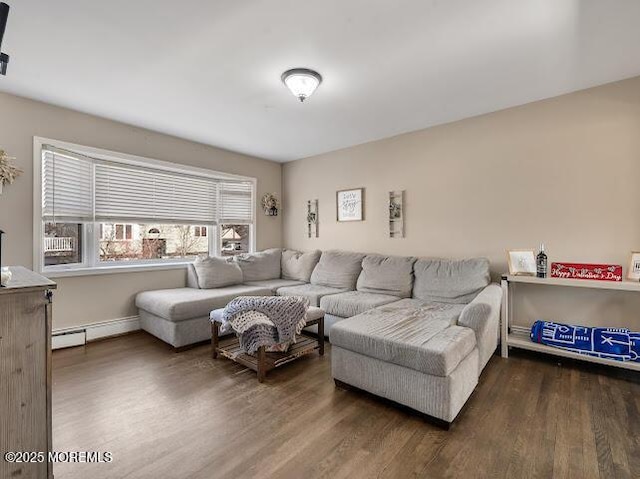 living room with a baseboard heating unit and dark hardwood / wood-style floors