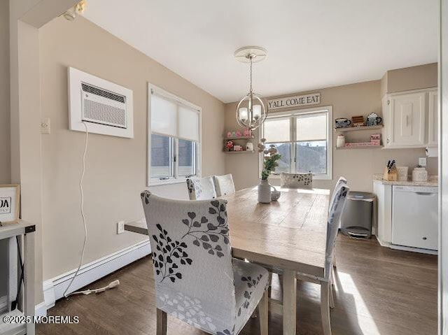 dining room with dark hardwood / wood-style flooring, a baseboard heating unit, and an AC wall unit