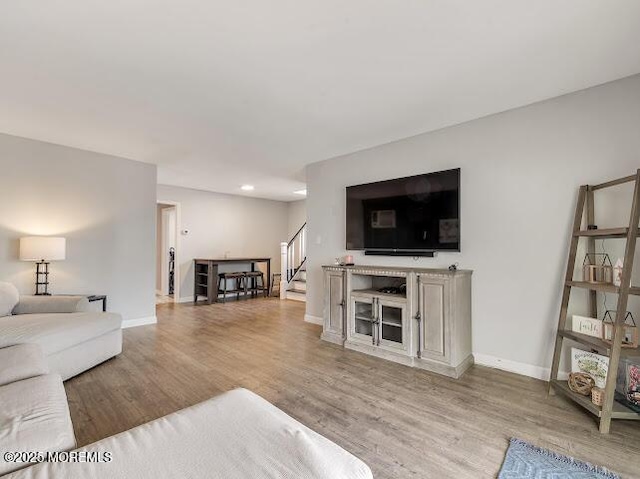 living room with light hardwood / wood-style flooring