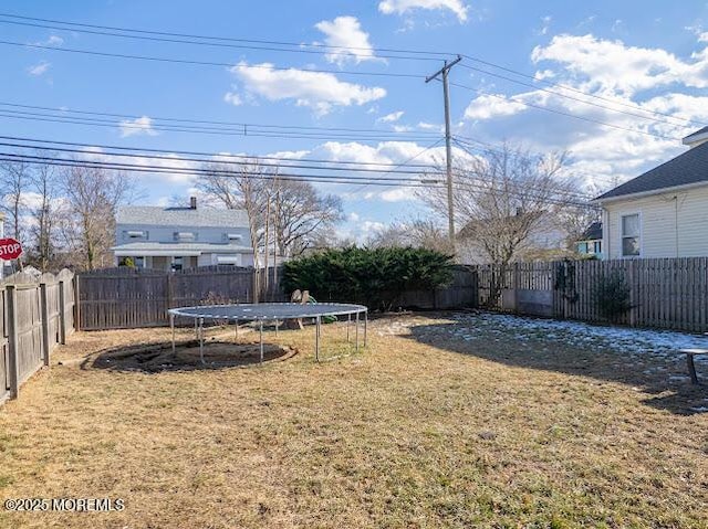 view of yard with a trampoline