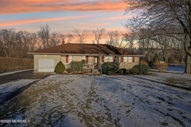 view of front of property with a garage