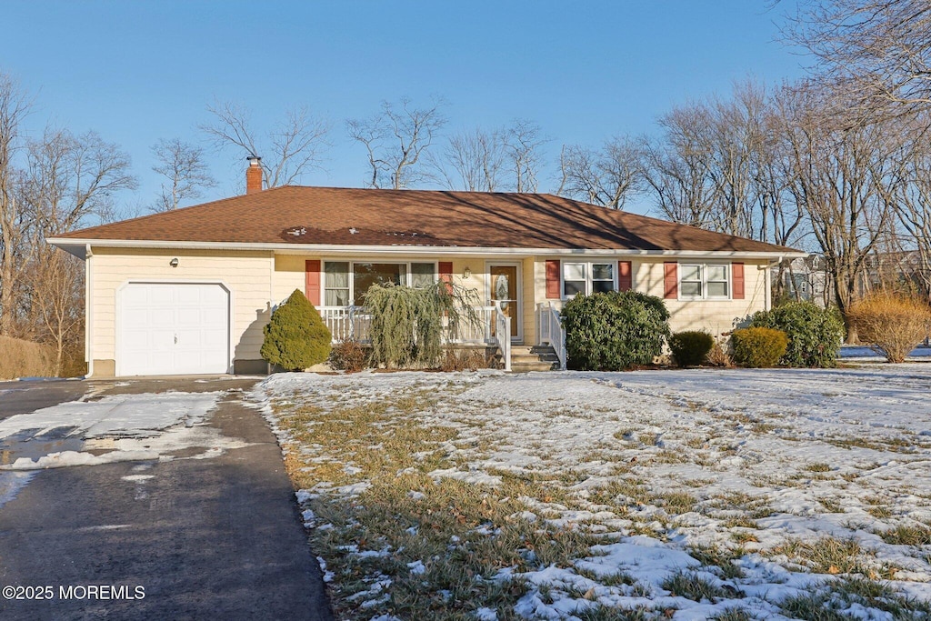 ranch-style house featuring a garage