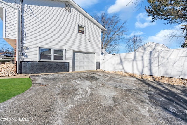 view of side of property with a garage