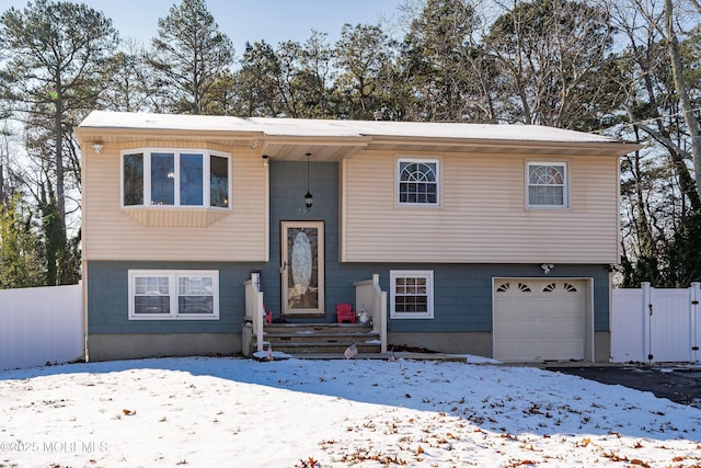 raised ranch featuring a garage