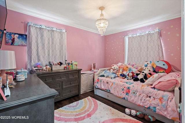 bedroom featuring crown molding, dark hardwood / wood-style flooring, and a chandelier