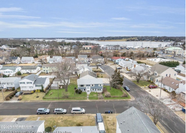 bird's eye view featuring a residential view and a water view