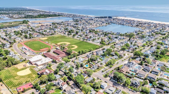 birds eye view of property with a residential view and a water view