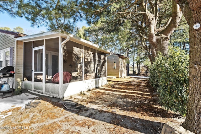 view of home's exterior featuring a sunroom