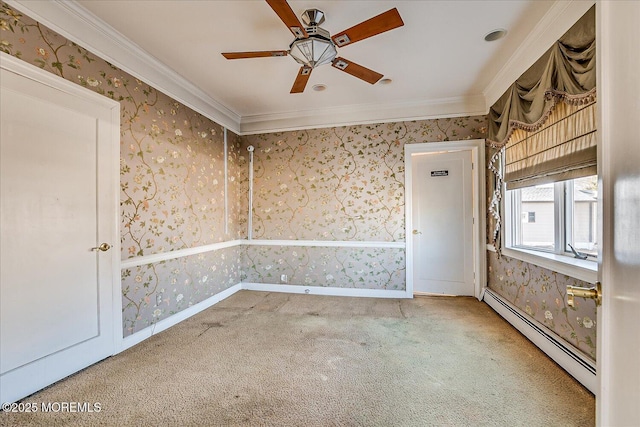 spare room with baseboard heating, ceiling fan, ornamental molding, and carpet flooring