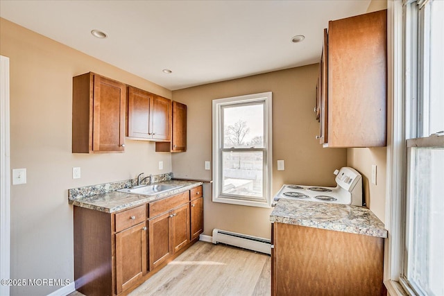 kitchen with a baseboard radiator, sink, white range with electric stovetop, and light wood-type flooring