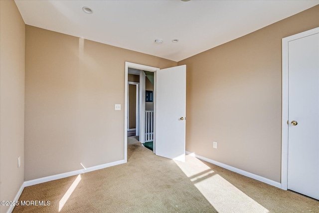 unfurnished bedroom featuring light colored carpet