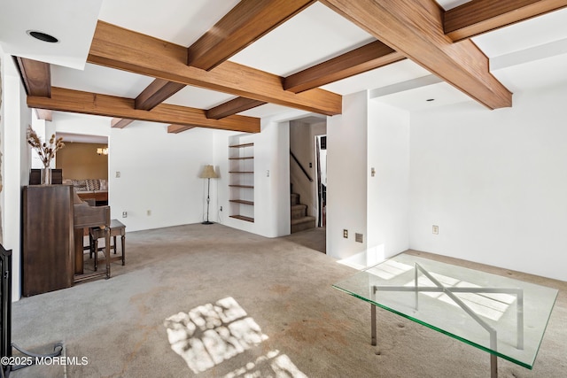 unfurnished living room with beamed ceiling, light carpet, and a notable chandelier