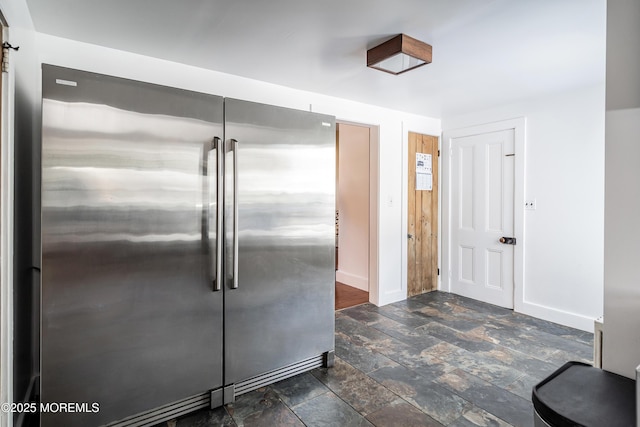 kitchen featuring stainless steel built in refrigerator