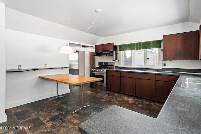 kitchen with gas range, lofted ceiling, dark brown cabinets, and pendant lighting