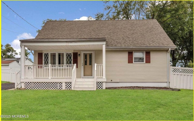 view of front of house with a front yard and a porch