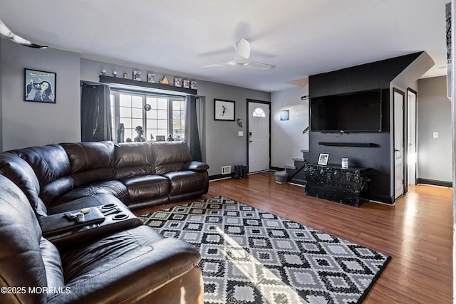 living room with hardwood / wood-style flooring and ceiling fan