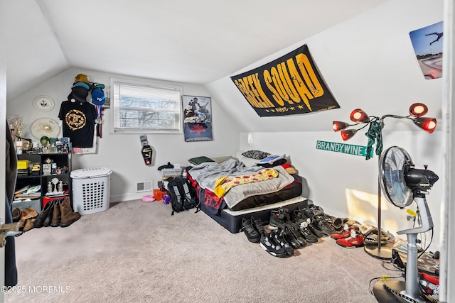 bedroom featuring vaulted ceiling and carpet flooring