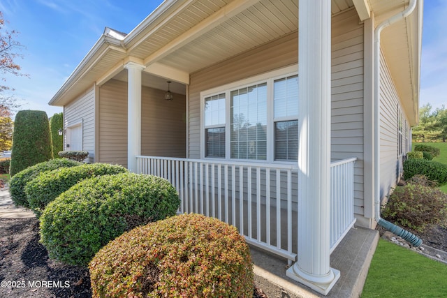 view of side of property with a porch