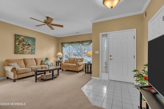 carpeted entrance foyer with crown molding and ceiling fan