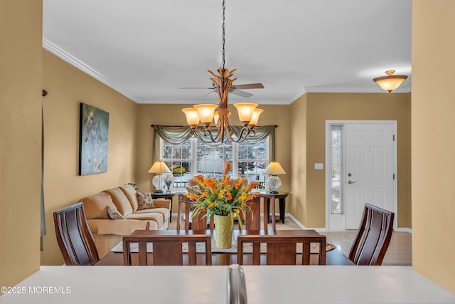 tiled dining area with crown molding and a notable chandelier