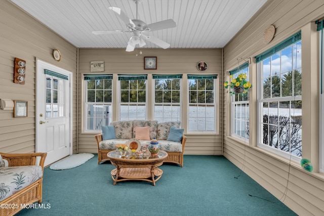 sunroom / solarium featuring ceiling fan and wooden ceiling