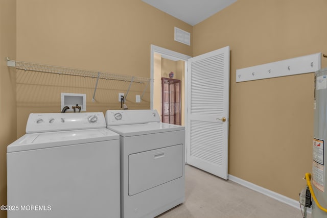 washroom with washer and dryer