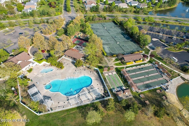 birds eye view of property with a water view