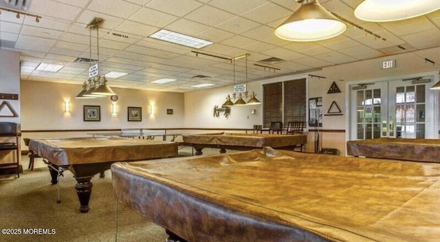 playroom with carpet floors, billiards, a paneled ceiling, and french doors