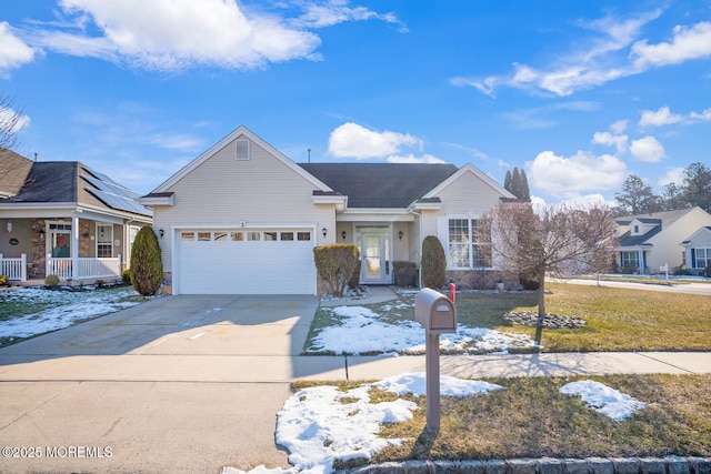 view of front of property with a garage, a front lawn, and covered porch