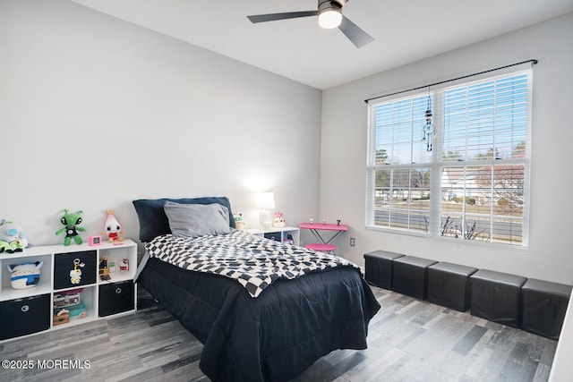 bedroom featuring ceiling fan and light hardwood / wood-style flooring