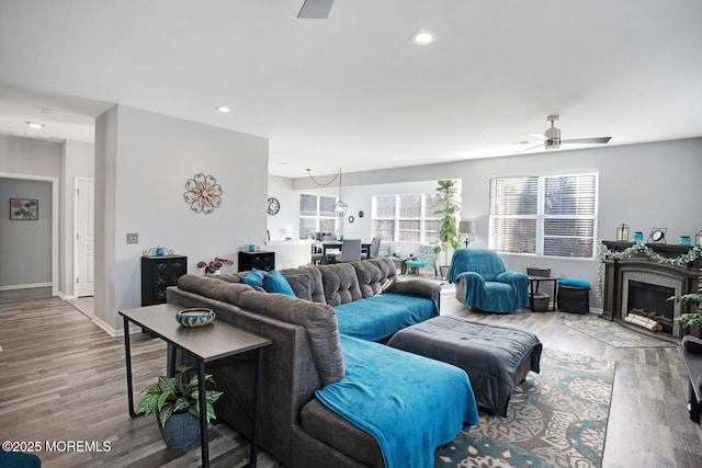 living room featuring hardwood / wood-style flooring and ceiling fan