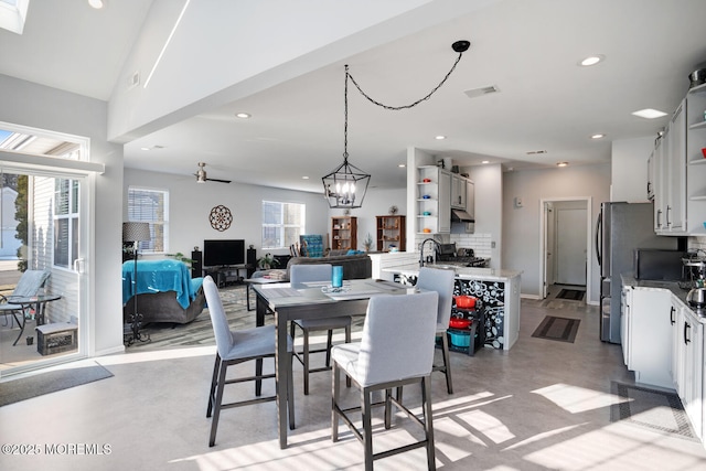 dining space with plenty of natural light and sink