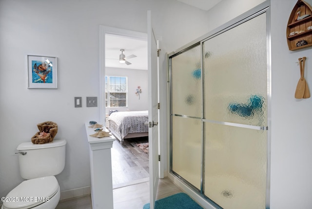 bathroom featuring walk in shower and toilet