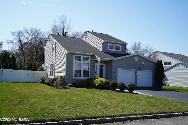 front facade with a garage and a front lawn