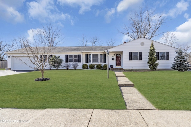 ranch-style home with a garage and a front yard