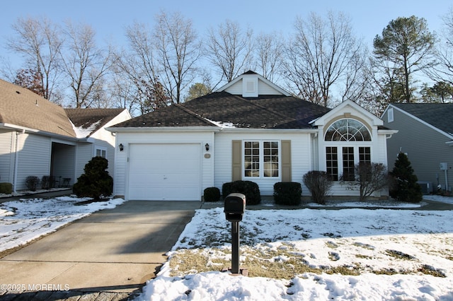 view of front of house featuring cooling unit and a garage