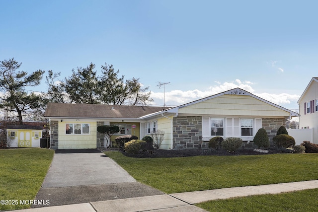 ranch-style home with a front lawn