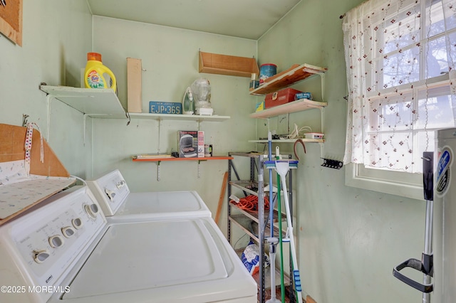 washroom featuring washing machine and clothes dryer