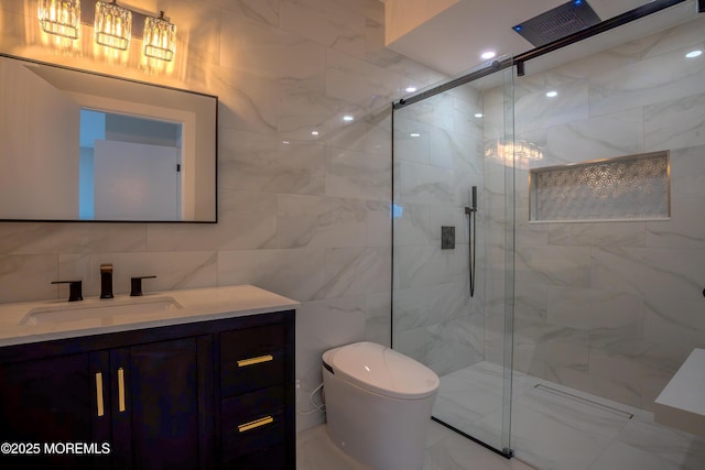 bathroom featuring walk in shower, vanity, toilet, and tile walls