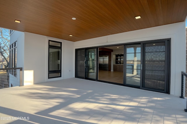 view of patio featuring a balcony