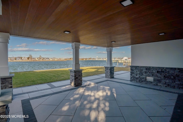 view of patio featuring a water view