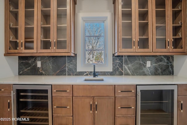 bar with wine cooler, sink, and decorative backsplash