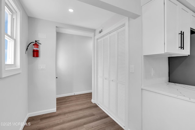 hallway featuring light hardwood / wood-style flooring