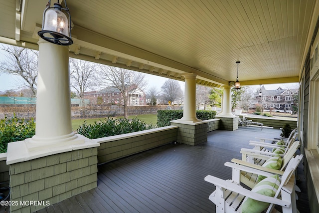 wooden terrace with a porch