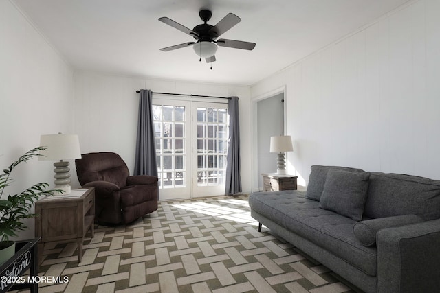 living room with french doors, light colored carpet, and ceiling fan